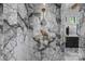 Luxurious marble shower with gold fixtures and a rainfall shower head, creating a spa-like experience at 3209 Mayfield Ave # 11, Charlotte, NC 28209