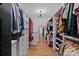 Well-organized walk-in closet with custom shelves, drawers, and a stylish light fixture showcasing ample storage space at 3209 Mayfield Ave # 11, Charlotte, NC 28209