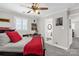 Bedroom featuring a ceiling fan, neutral color scheme and adjacent bathroom access at 323 Richmond Rd, Salisbury, NC 28144