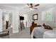 Comfortable bedroom featuring a ceiling fan and access to an ensuite bathroom at 323 Richmond Rd, Salisbury, NC 28144