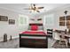 Bedroom with ceiling fan, decorative wall art, and natural light from window with shutters at 323 Richmond Rd, Salisbury, NC 28144