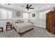 Serene bedroom with plantation shutters and a ceiling fan at 323 Richmond Rd, Salisbury, NC 28144