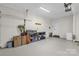 Spacious garage with epoxy floors, organized shelving, and ample storage space at 323 Richmond Rd, Salisbury, NC 28144
