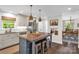 Bright kitchen featuring island with seating, stainless appliances, and custom cabinets at 323 Richmond Rd, Salisbury, NC 28144