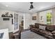 Cozy living room features hardwood floors, stylish rug, and open access to dining area at 323 Richmond Rd, Salisbury, NC 28144