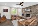 Inviting living room with a stone fireplace, hardwood floors, and neutral walls at 323 Richmond Rd, Salisbury, NC 28144
