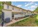 Townhome backyard with a small patio area, walkway, and grassy area at 3726 Park Rd, Charlotte, NC 28209