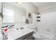 Clean and functional bathroom featuring a shower-tub combo and a vanity with storage at 3726 Park Rd, Charlotte, NC 28209