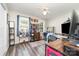 Bright bedroom with a ceiling fan, large windows, and a variety of decor at 3726 Park Rd, Charlotte, NC 28209