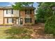 Well-maintained brick townhome featuring a cozy front entrance and manicured landscaping at 3726 Park Rd, Charlotte, NC 28209
