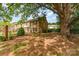 Charming townhome with brick facade and mature tree providing ample shade at 3726 Park Rd, Charlotte, NC 28209