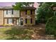 Charming brick townhome featuring black shutters, a well-kept lawn, and a cozy entrance at 3726 Park Rd, Charlotte, NC 28209