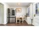 Cozy kitchen with a stainless steel refrigerator and dining area with bright natural light at 3726 Park Rd, Charlotte, NC 28209