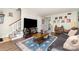 Comfortable living room with hardwood floors, contemporary rug, and staircase at 3726 Park Rd, Charlotte, NC 28209