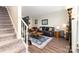 Cozy living room with plush seating, a stylish rug, and staircase at 3726 Park Rd, Charlotte, NC 28209
