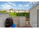Charming outdoor patio with a grill, table, and serene backdrop at 3726 Park Rd, Charlotte, NC 28209