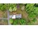 An aerial view of property with a large yard surrounded by trees, including metal carports at 3816 Redman Rd, Shelby, NC 28150
