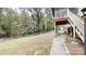 This back porch has a nice view of the backyard and surrounding woods at 3816 Redman Rd, Shelby, NC 28150