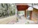 Back porch with chairs and a small table, and a view of the backyard at 3816 Redman Rd, Shelby, NC 28150