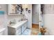 This bathroom features a white sink and vanity, along with a decorative mirror and nautical-themed decor at 3816 Redman Rd, Shelby, NC 28150
