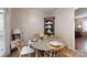 Charming dining area featuring a round table, stylish chairs, and decorative corner cabinet at 3816 Redman Rd, Shelby, NC 28150