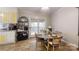 Cozy dining area with a gray round table, seating for four, and sliding glass doors to a porch at 3816 Redman Rd, Shelby, NC 28150