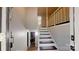 Bright entryway with staircase featuring carpeted steps and white railing at 3816 Redman Rd, Shelby, NC 28150