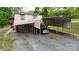 View of the house exterior showing carports and a gravel drive at 3816 Redman Rd, Shelby, NC 28150