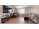 Relaxing living room featuring hardwood floors, a plush recliner, and a window seat at 3816 Redman Rd, Shelby, NC 28150