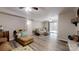 Spacious living room with hardwood floors, neutral paint, a brown sofa, and access to an outdoor area at 3816 Redman Rd, Shelby, NC 28150
