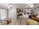 The living room has a gray wood floor, a ceiling fan and a fireplace at 3816 Redman Rd, Shelby, NC 28150