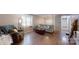 Cozy living room featuring hardwood floors, comfortable seating, and ample natural light at 3816 Redman Rd, Shelby, NC 28150