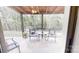 Outdoor patio area perfect for entertaining, with chairs, table, and view of backyard at 3816 Redman Rd, Shelby, NC 28150