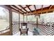 Screened in porch with comfortable wicker furniture, creating a peaceful retreat at 3816 Redman Rd, Shelby, NC 28150