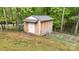 A detached storage shed in a spacious, tree-lined backyard at 3816 Redman Rd, Shelby, NC 28150