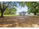 Large backyard with lots of trees and grass at 403 Broad St, Kannapolis, NC 28081