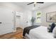 Bedroom with a walk-in closet, ceiling fan, and a large window at 403 Broad St, Kannapolis, NC 28081