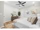 Neutral bedroom boasts a ceiling fan, ample space, and natural light at 403 Broad St, Kannapolis, NC 28081