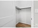 A clean and minimal closet space with rod for hanging clothes at 403 Broad St, Kannapolis, NC 28081