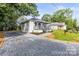 Exterior elevation showing the home's gravel driveway and low-maintenance landscaping at 403 Broad St, Kannapolis, NC 28081