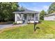 This home has beautiful curb appeal, with manicured grass and landscaping at 403 Broad St, Kannapolis, NC 28081
