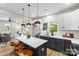 Kitchen area featuring an island with seating and an adjacent living room at 403 Broad St, Kannapolis, NC 28081