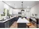 Bright eat-in kitchen features modern appliances, a center island, and stylish pendant lighting at 403 Broad St, Kannapolis, NC 28081