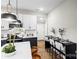 Kitchen with modern appliances, a center island, and a dining table at 403 Broad St, Kannapolis, NC 28081