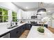 Well-lit kitchen boasts modern appliances, ample countertop space, and a view of the outdoors at 403 Broad St, Kannapolis, NC 28081