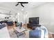 Spacious living area with modern furnishings, leading into the open kitchen at 403 Broad St, Kannapolis, NC 28081