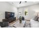 Cozy living room featuring modern decor and wood laminate flooring at 403 Broad St, Kannapolis, NC 28081