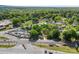 Overhead shot of a property featuring a gray house near train tracks and a car lot at 4304 S Falls St, Gastonia, NC 28056