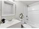 A staged bathroom with a modern vanity and shower-tub combo at 4304 S Falls St, Gastonia, NC 28056