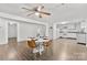 Cozy dining area with hardwood floors, a ceiling fan, and a view into the kitchen at 4304 S Falls St, Gastonia, NC 28056